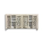 Wooden cabinet with decorative lattice doors.