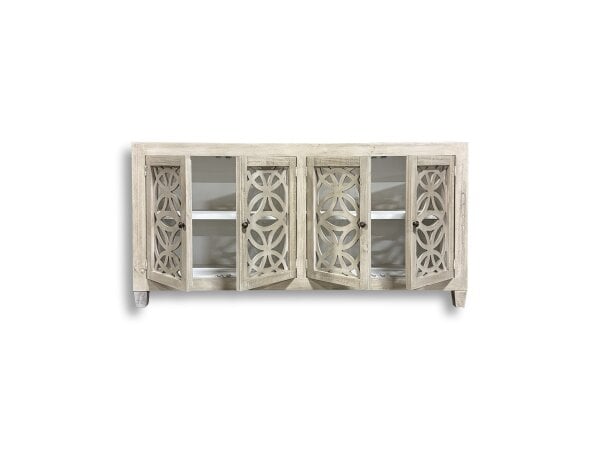 Wooden cabinet with decorative lattice doors.